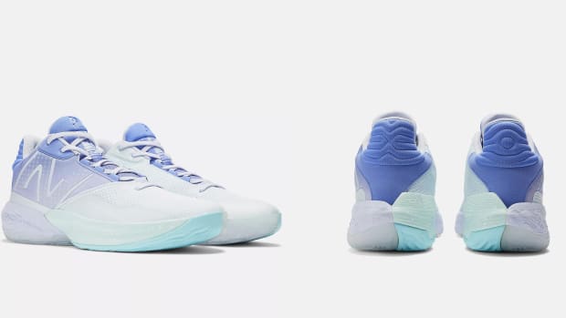 Side and rear view of blue and white New Balance basketball shoes.
